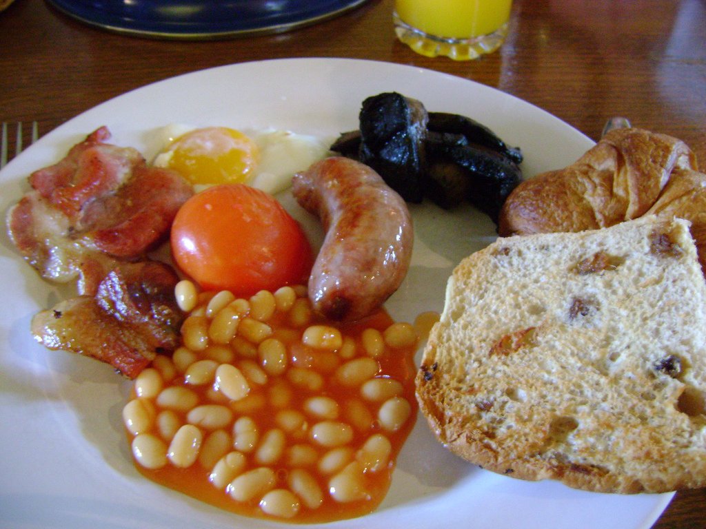 ENGLAND: The typical breakfast includes eggs, sausage, bacon, beans, and mushrooms.